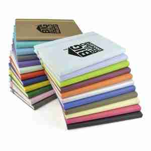 Piles of coloured notebooks with printed with company logos
